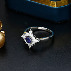 Round Cut Blue Zircon Flower Halo Silver Ring