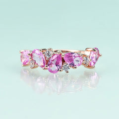Row of Pear Shape Barbie Pink Corundum and Zircon Silver Ring