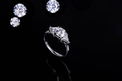 Round and Triangle Moissanite Three Stone Engagement Ring
