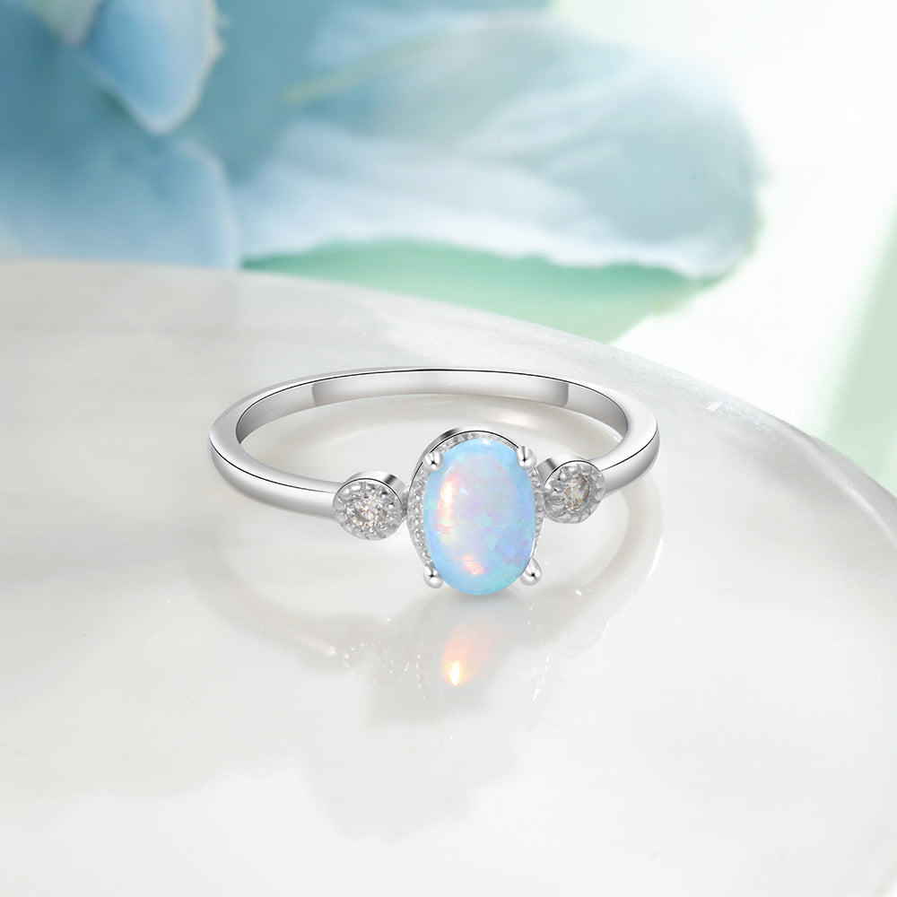 Oval Blue Opal with Two Small Zircon Sterling Silver Ring