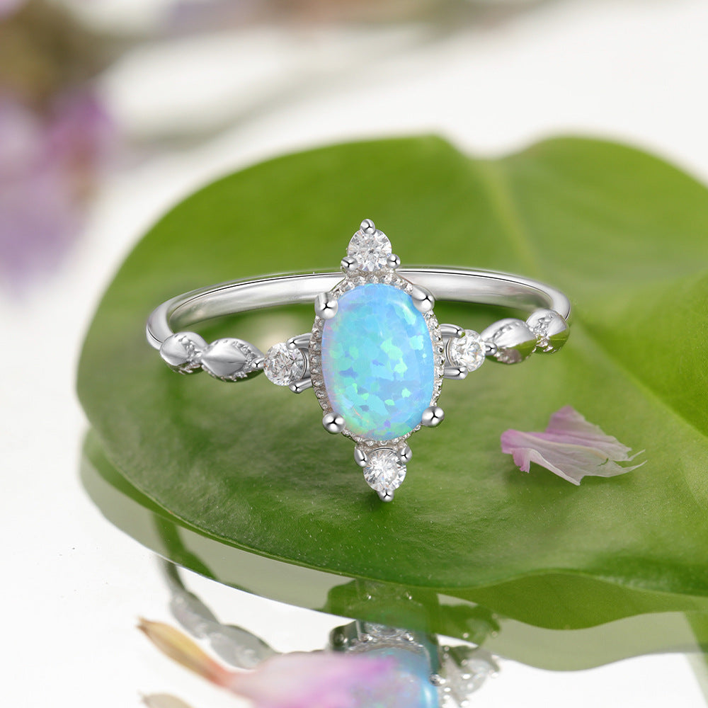 Oval Blue Opal with Four Small Zircon Sterling Silver Ring