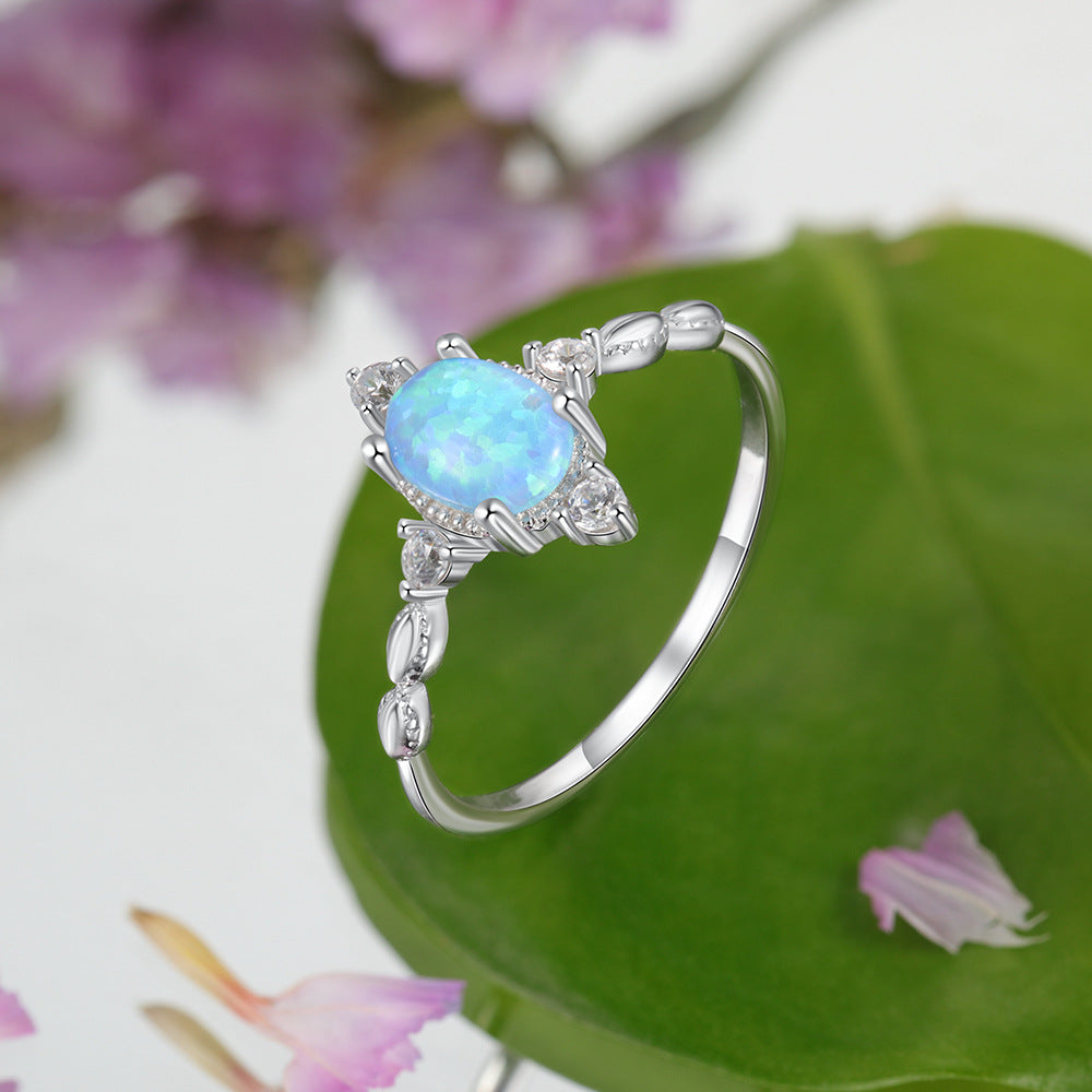 Oval Blue Opal with Four Small Zircon Sterling Silver Ring