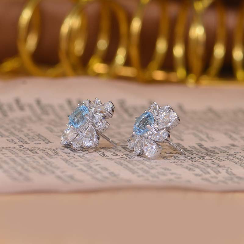 Annular Petals Round Natural Blue Topaz Studs