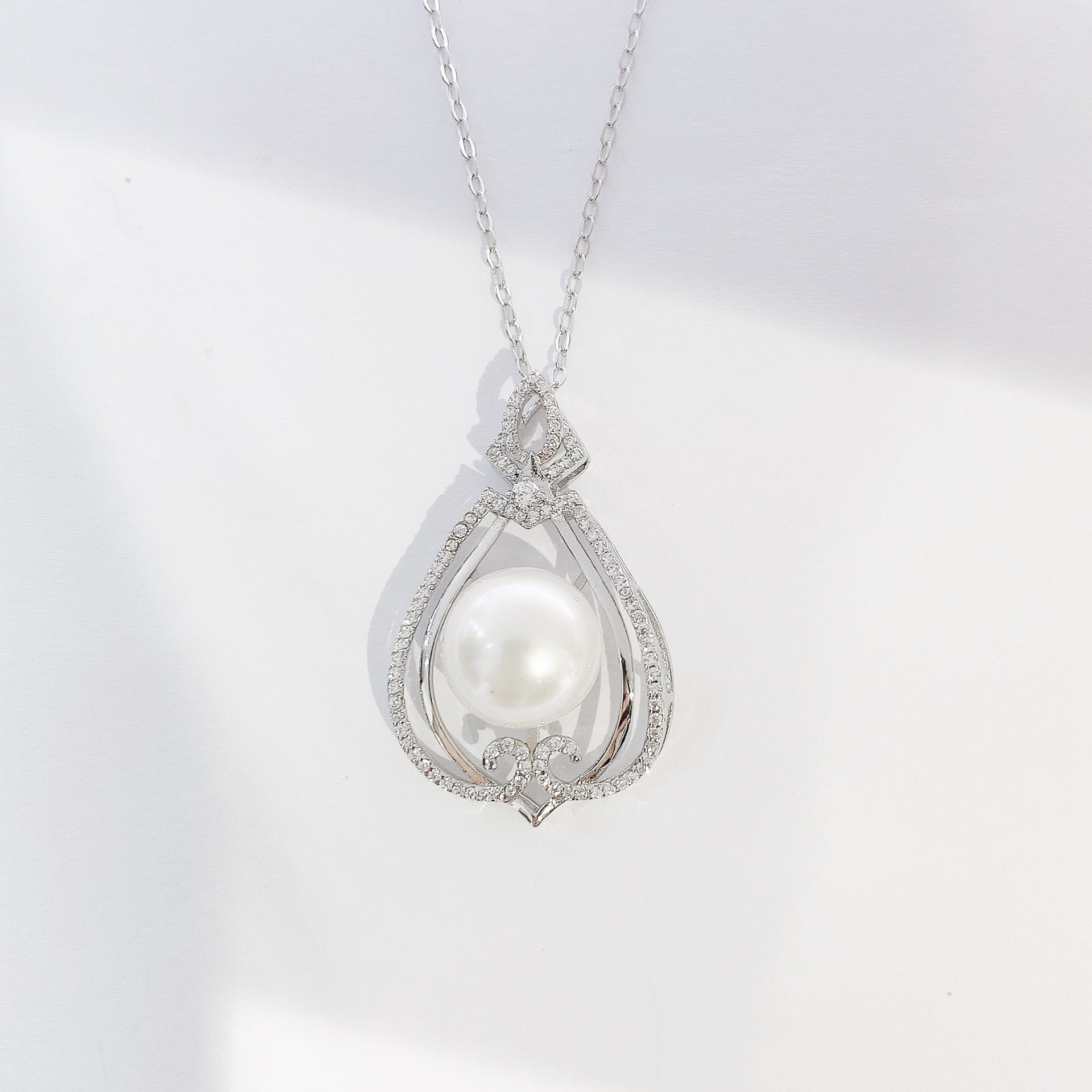 Hollow Pear Drop Shape with Round Natural Pearl Pendant Silver Necklace for Women