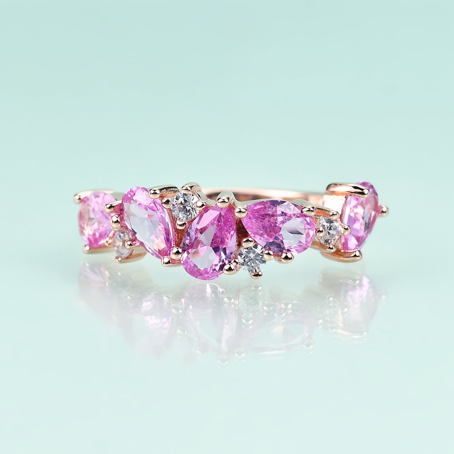 Row of Pear Shape Barbie Pink Corundum and Zircon Silver Ring