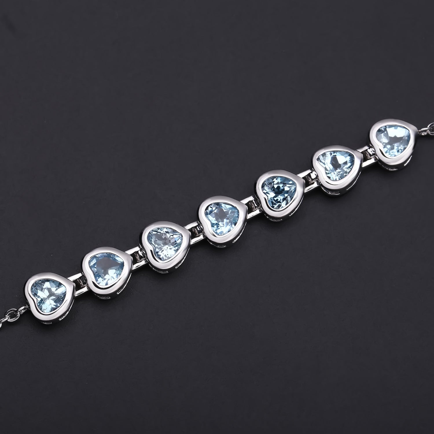 Row of Heart Shape Natural Blue Topaz Silver Bracelet