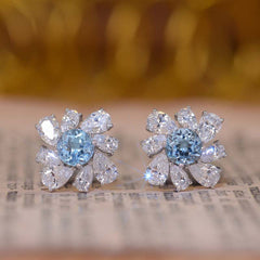 Annular Petals Round Natural Blue Topaz Studs