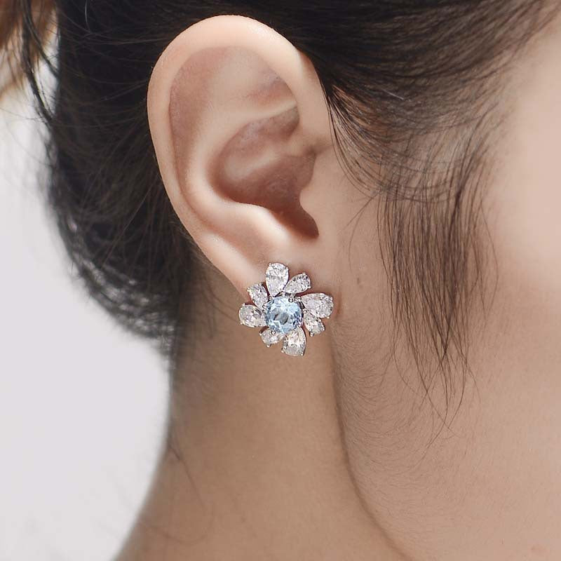 Annular Petals Round Natural Blue Topaz Studs