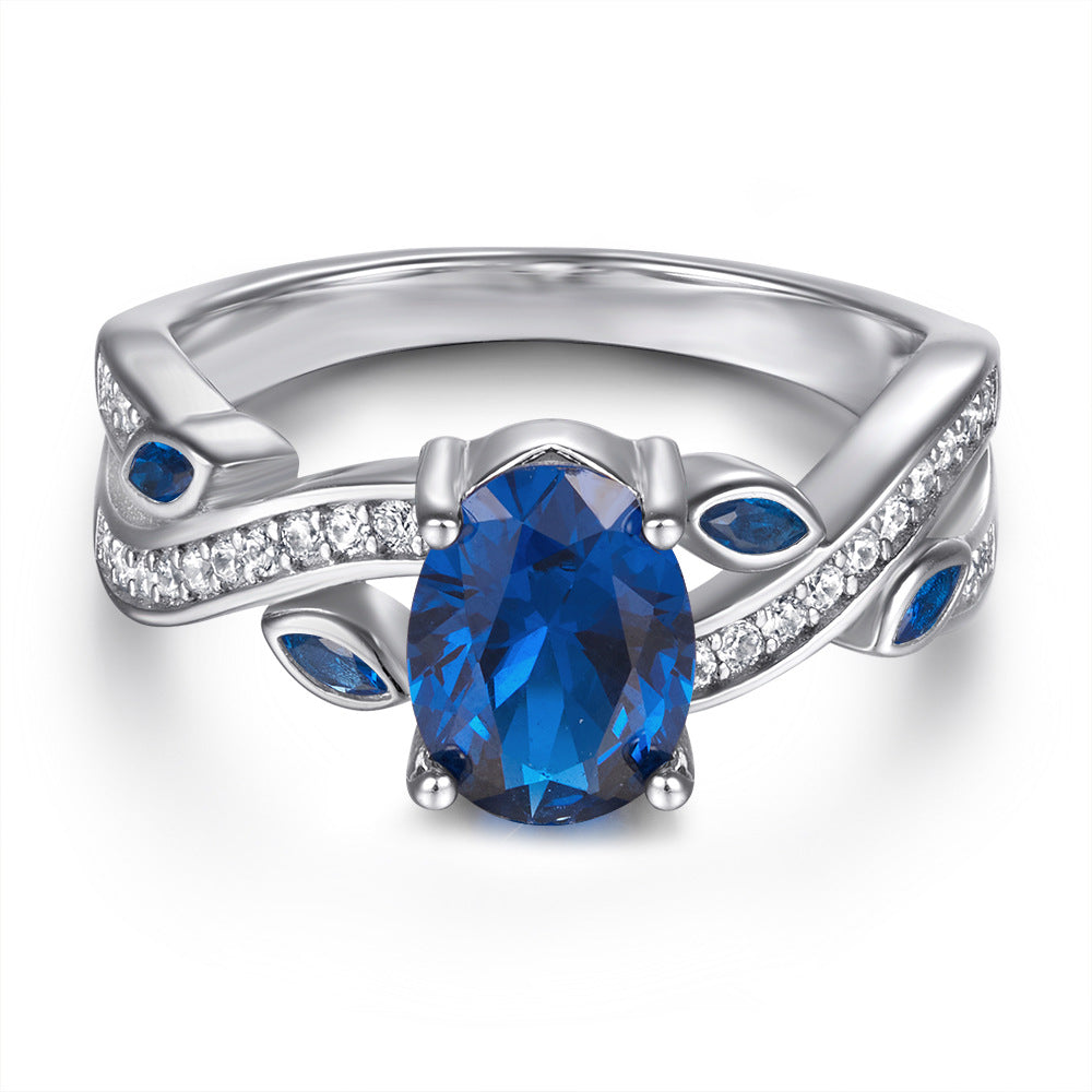 Blue Oval Zircon with Hollow Pattern Silver Ring for Women