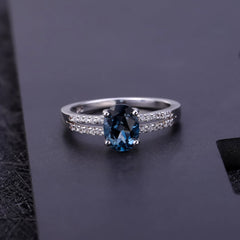 Oval Natural Blue Topaz Split Shank Silver Ring